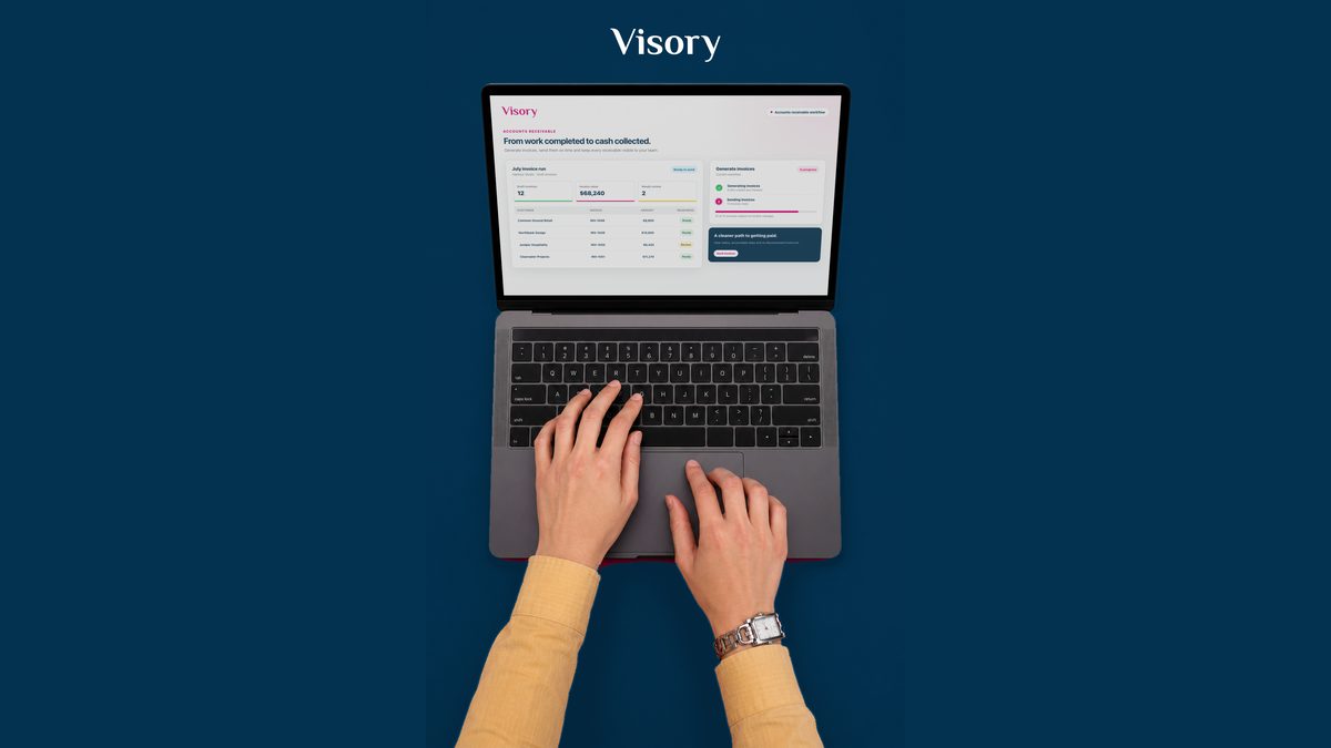 Top-down view of the Visory accounts receivable workflow on a laptop